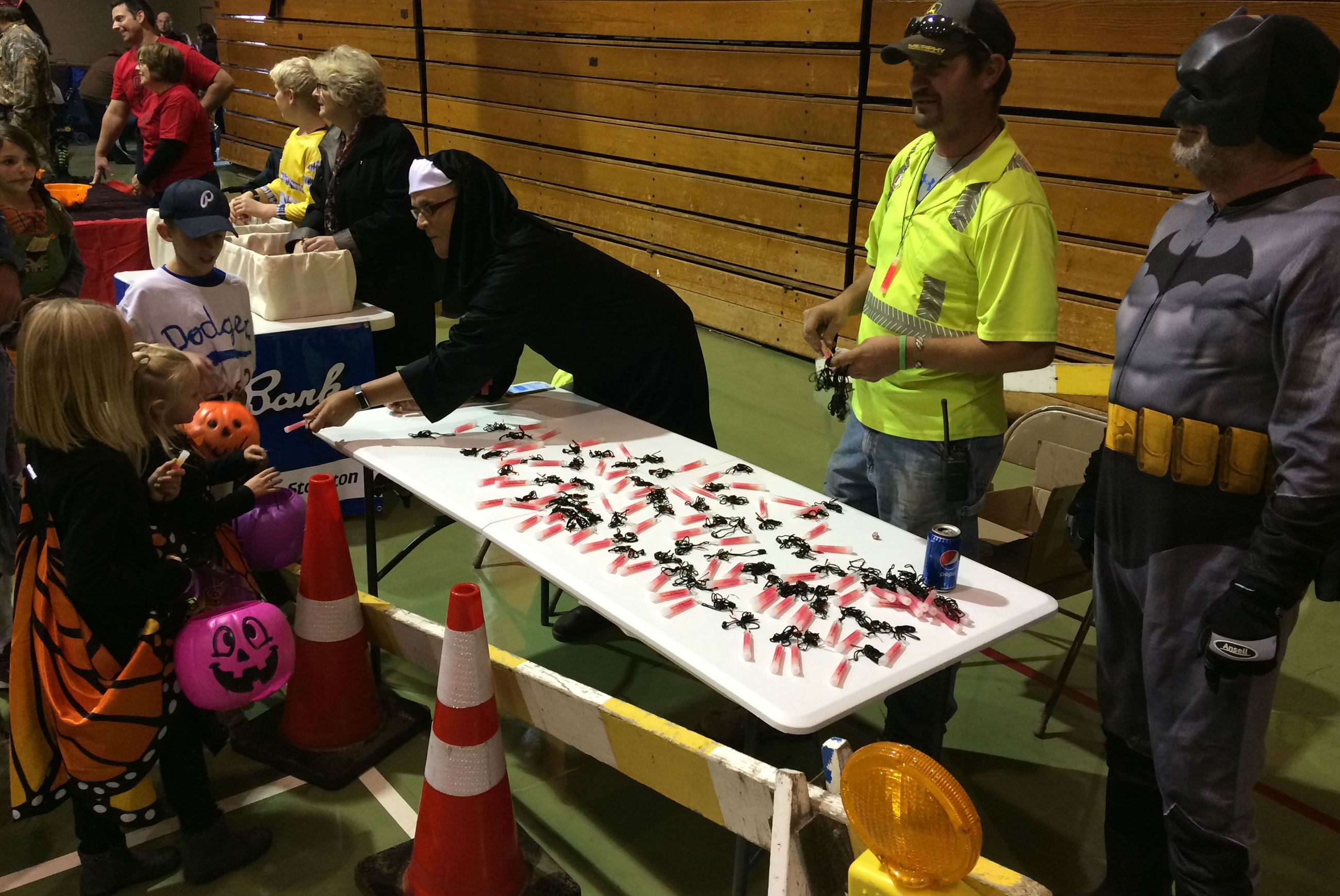 City booth handing out safety necklaces